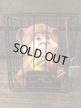 MONKEY EATING BANANA IN CAGE