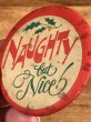 Naughtyのメッセージが書かれたヴィンテージ缶バッチ